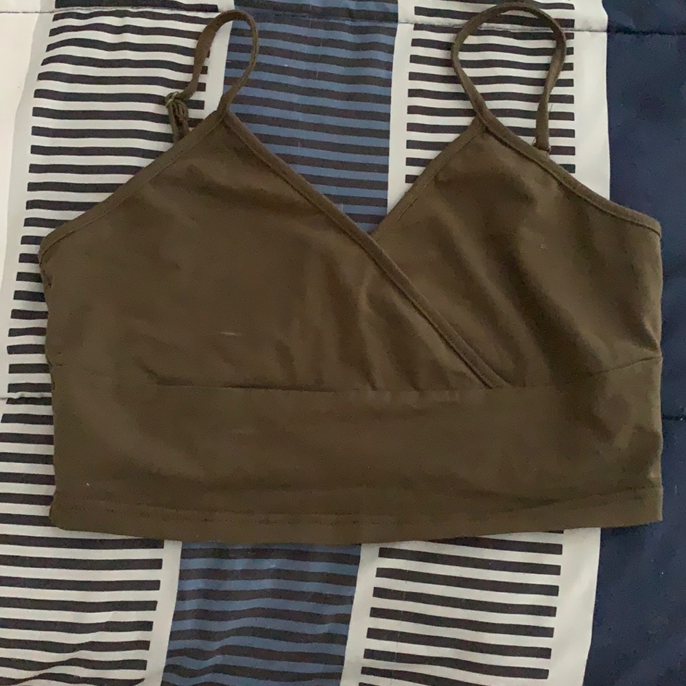 A tank/crop top w/ cross in front.